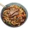 A bowl of Sushiro-Beef-Udon, vegetables, and sauce held by chopsticks, set against a black background, conveying a savory tone.